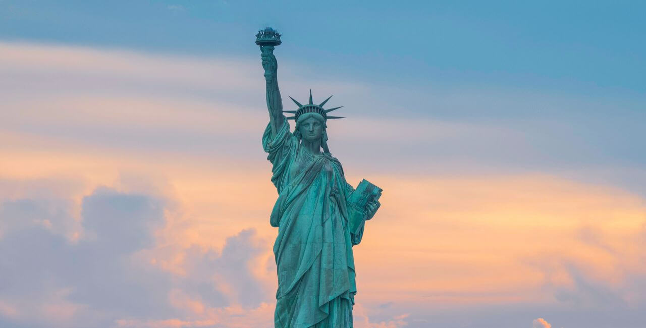 statue of liberty sunset skyline